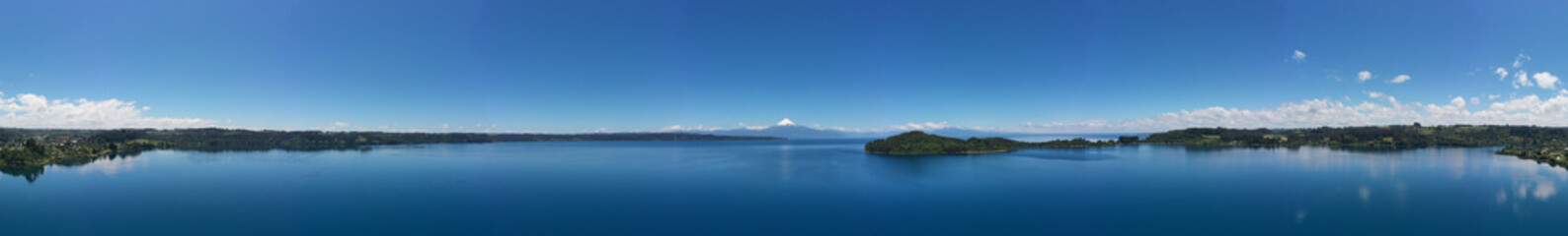Aerial PANORAMIC landscape of Osorno Volcano and Llanquihue Lake - Puerto Varas, Chile, South America.