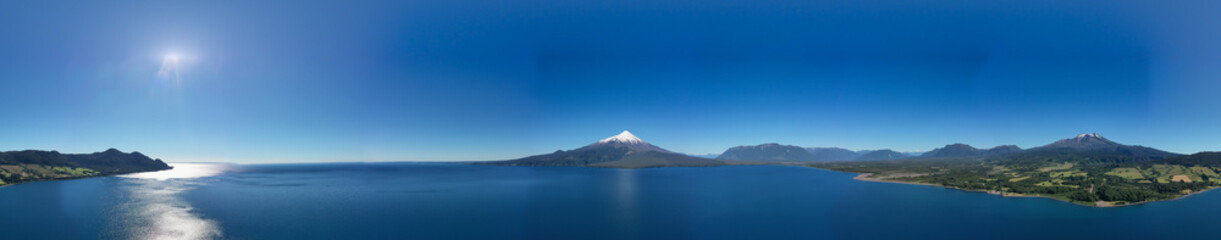 Naklejka na ściany i meble Aerial PANORAMIC landscape of Osorno Volcano and Llanquihue Lake - Puerto Varas, Chile, South America.