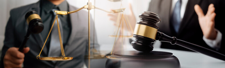 Business and lawyers discussing contract papers with brass scale on desk in office. Law, legal...