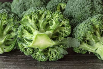fresh broccoli on a wooden background close-up. background with fresh broccoli. broccoli stalk forward close-up.