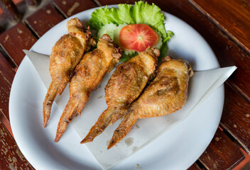 Fired Chicken wings marinated in traditional. lots of fired chicken wing on plate. Chicken fired unhealthy food.