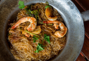Baked prawn with Glass Noodles and chinese sauce, yummy mixed thai and china cuisine " Kung Ob Woon Sen". imagr for background, wallpaper and menu list. © kanpisut