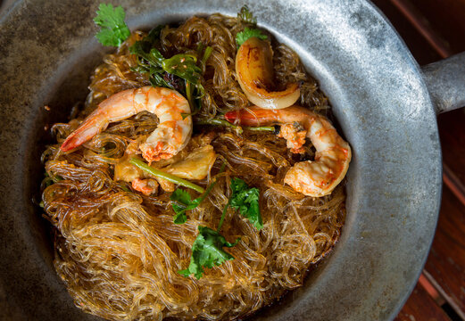 Baked prawn with Glass Noodles and chinese sauce, yummy mixed thai and china cuisine " Kung Ob Woon Sen". imagr for background, wallpaper and menu list.