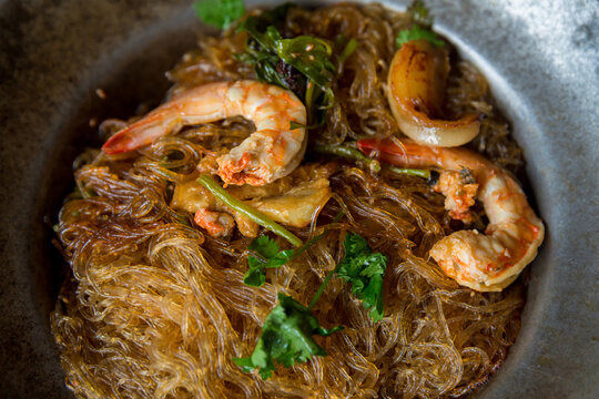 Baked prawn with Glass Noodles and chinese sauce, yummy mixed thai and china cuisine " Kung Ob Woon Sen". imagr for background, wallpaper and menu list.