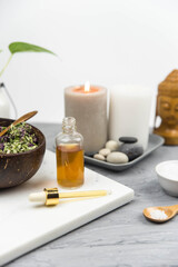 Bottle natural organic oil essence serum with healing herbs and sea salt. Aromatherapy and beauty. Concept set of harmony, balance and meditation, spa, massage, relax, beauty spa treatment.