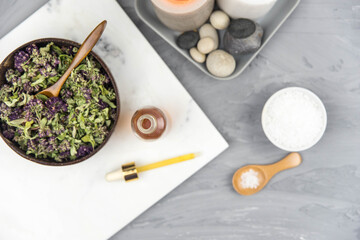 Bottle natural organic oil essence serum with healing herbs and sea salt. Aromatherapy and beauty. Concept set of harmony, balance and meditation, spa, massage, relax, beauty spa treatment.