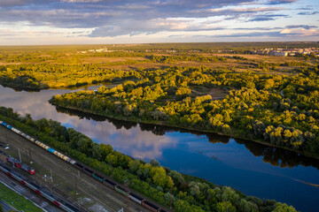 panoramic view of the motorway across the river against the backdrop of a green forest