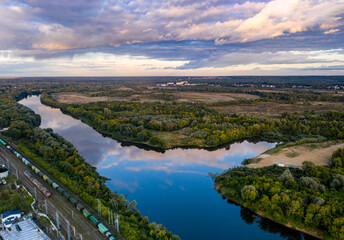 panoramic view of the motorway across the river against the backdrop of a green forest