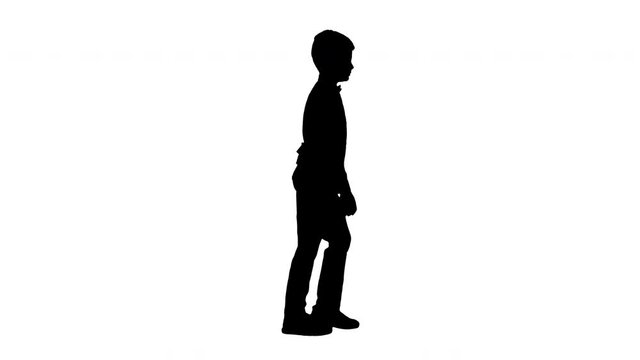 Silhouette Little boy in a waistcoat and a bow tie walking looking straight ahead.