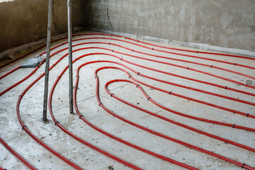 Tubes of the underfloor heating system on a styrofoam insulation