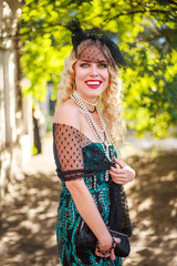Elegant young lady in fashionable dress retro style, natural beauty portrait outdoors in sunlight