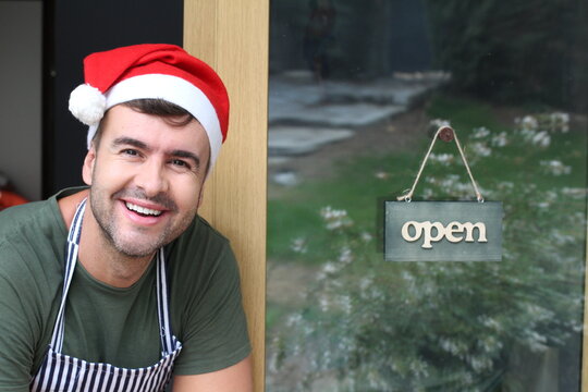 Barista wearing Santa hat during Christmas season