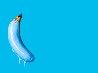 banana painted blue on a blue background