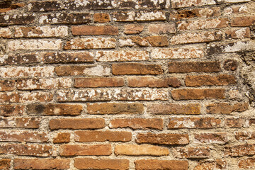 Texture of an old wall made red bricks - background photo