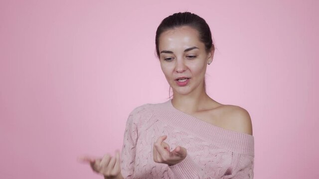 Beautiful caucasian young woman lists all the virtues of her beloved online store