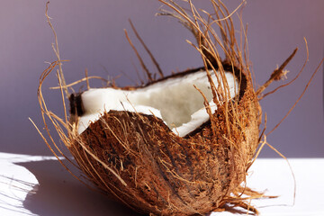 Naklejka na ściany i meble half coconut on a white background, top view