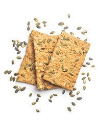 The  crispy bread with pumpkin seeds. Knackebrot on white background.