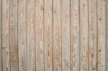 Fototapeta na wymiar Texture of narrow light wood planks with veins and knots. Vertical narrow boards. Wooden pattern for designers