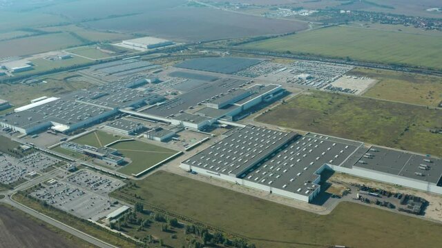 Factory on green field in europe. View from above on industrial territory and many cars nearby. White trucks on the parking zone. Aerial view.
Automotive slovakia PSA peugeot cAutomotive slovakia PSA 