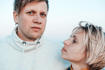 a man and a woman relax on the beach. Sunny day ,sunset . love story . family