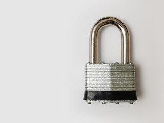 Locked padlock on white background with copy space.