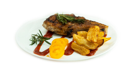 Grilled steak with baked potatoes and fresh yellow tomatoes on a white background. High quality photo