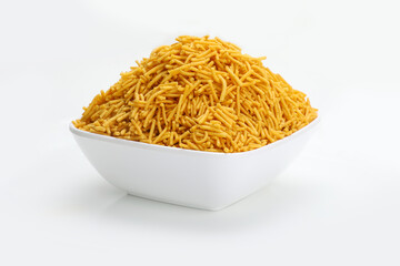 Indian snacks aloo bhujiaa in white bowl in white background.