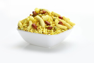 Khatta mitha chivda or namkeen Indian snacks in white bowl in white background.