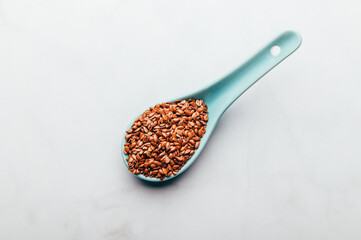 Brown Linseeds in spoon