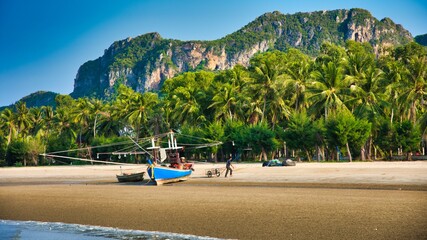 Thai Boat at Beach with Palmtrees