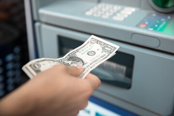 Woman withdrawing money from ATM