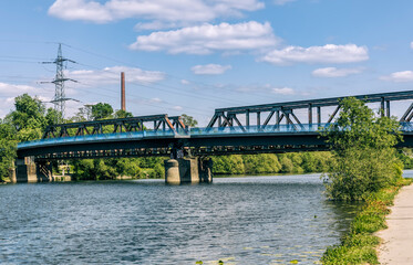 Ruhr River with old railroad bridge and modern footbridge - Bochum, NRW, Germany
