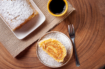 Swiss roll cake stuffed with dulce de leche. Roulade cake. Top view