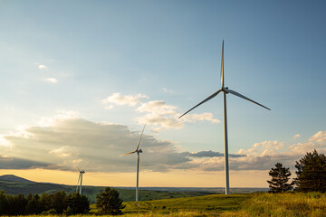 Fototapeta na wymiar Alternative Energy. Wind farm. Aerial view of horizontal-axis wind turbines generating electricity Wind energy. Clean renewable energy technologies. Wind power plants