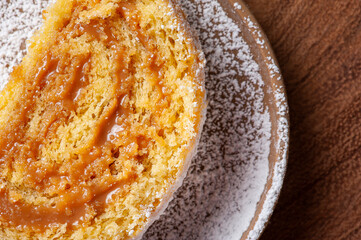 Swiss roll cake stuffed with dulce de leche. Roulade cake. Top view