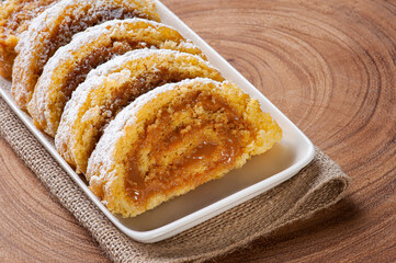 Swiss roll cake stuffed with dulce de leche. Roulade cake.