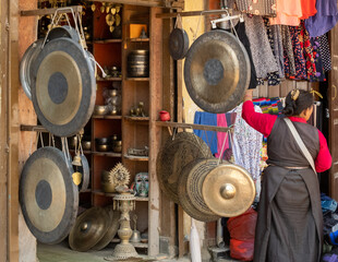 Nepalese and Tibetan gongs at the entrance to a shop in Kathmandu. Singing bowls and Buddhist sound therapy shop