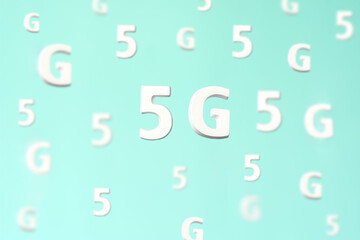 Pattern with large white flying letters 5 G on blue background. Creative concept. Modern wireless high speed mobile internet. Connection technology for cell, laptop, phone. Use at home, work,business