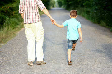 Fototapeta premium father and son go on the road
