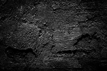 Beautiful black cement wall plastered surface background and texture pattern. Blank concrete dark rough wall for background.