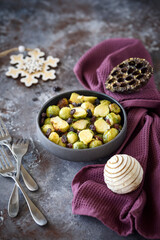 Grilled brussels sprouts served with Christmas decoration,selective focus