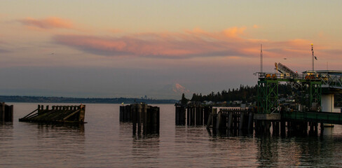 General view of Kingston, Washington ferry dock over the Puget Sound with Mount Rainier under the...