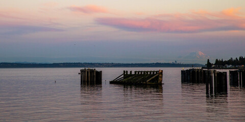 General view of the Kingston, Washington ferry dock and the puget sound as the sun sets behind Mt. Rainier