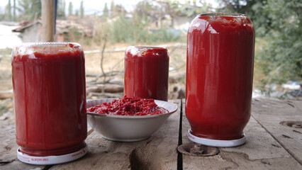 The tomato sauce made with traditional methods in Turkey. Natural, additive-free. in a copper pot. It is boiling over wood fire.