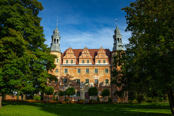 Fototapeta na wymiar Palace in Polska Cerekiew over the blue sky. Sunny day. Summer time.