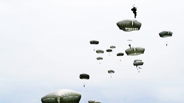 A bunch of paratroopers as they fall from the sky near Sainte-Mere-Eglise, France for the 75th commemoration of D-Day, June 9th, 2019