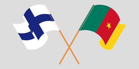 Crossed and waving flags of Cameroon and Finland