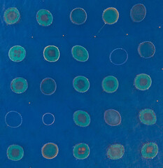 patterns on the sea level made from fish cultivation 
