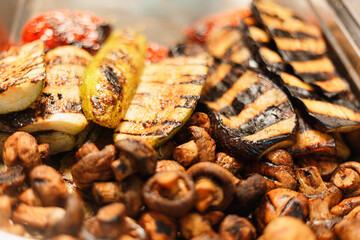 grilled fungi and vegetables on a grill
