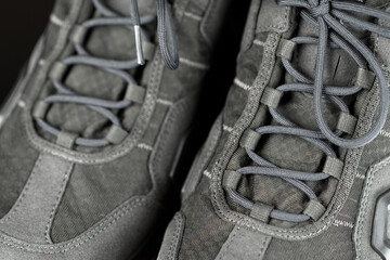 Fototapeta na wymiar laces of trekking sneakers, close-up view